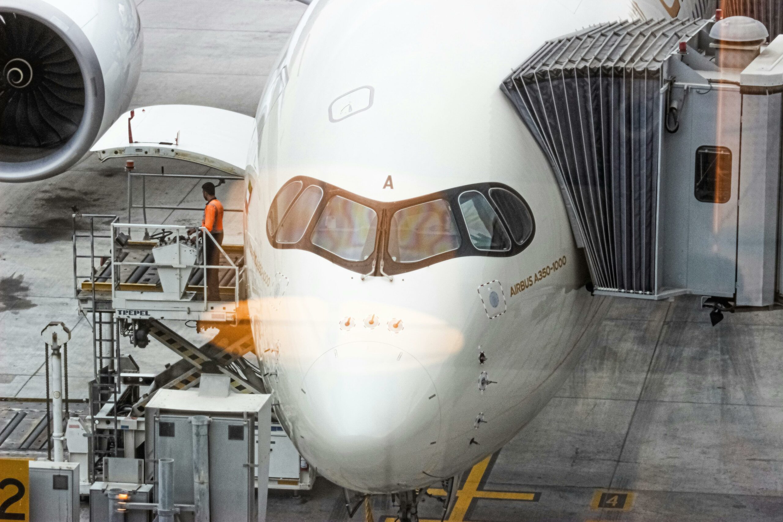 Airbus A350-1000 built with carbon fiber reinforced polymer composites – lightweight structure for efficiency and performance in aerospace.
