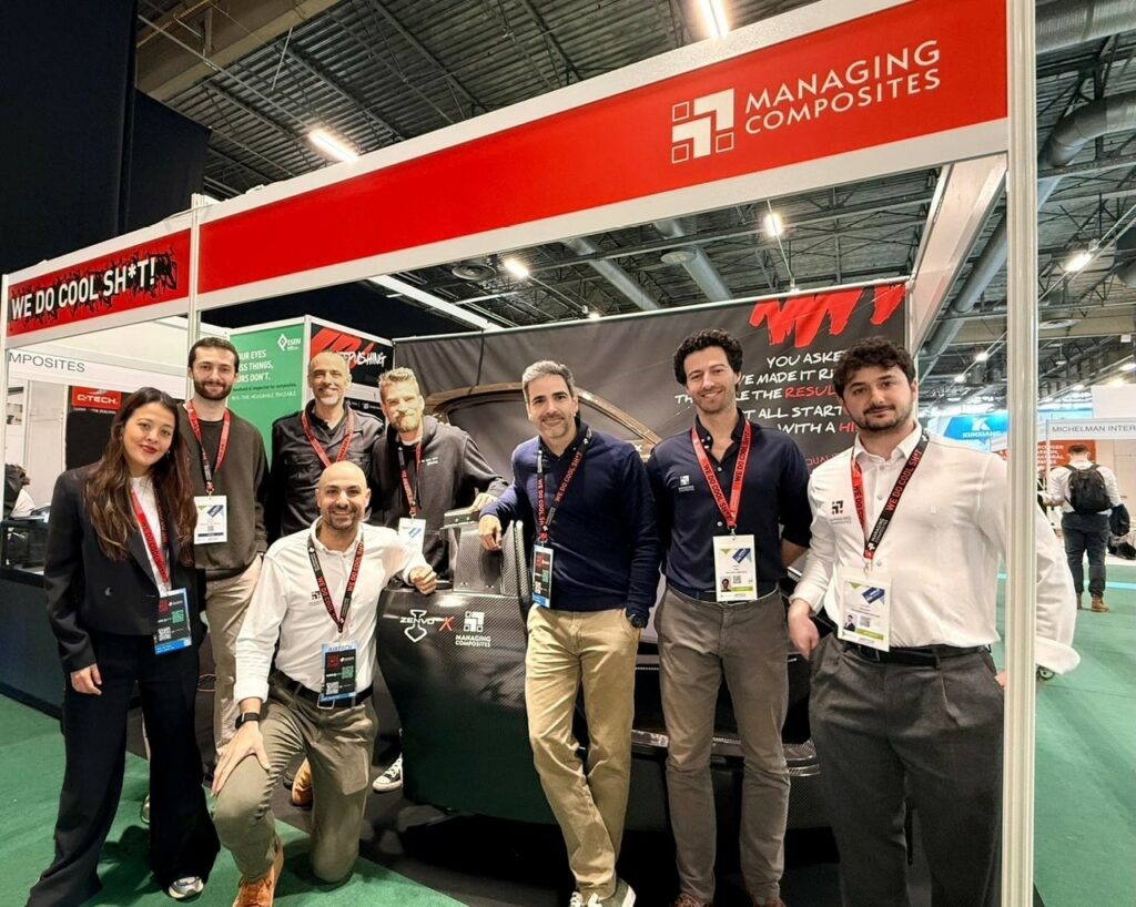 8 people of the Managing Composites team in front of their booth at Jec 2026